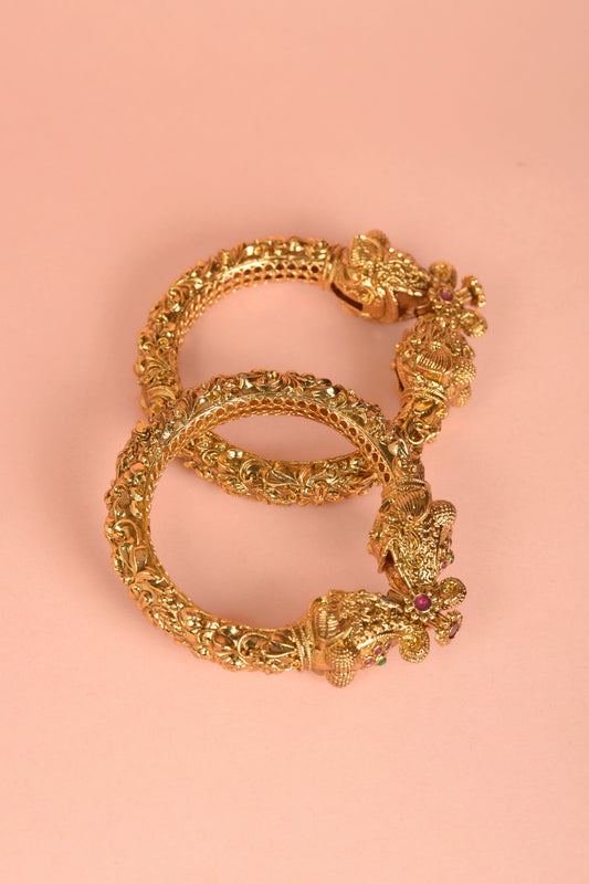 Hasti Heritage Kada | Carved 22kt Gold-Plated Nakashi Bangle with Elephant-Mouth Mohora & Ruby Accents (Set of 2)